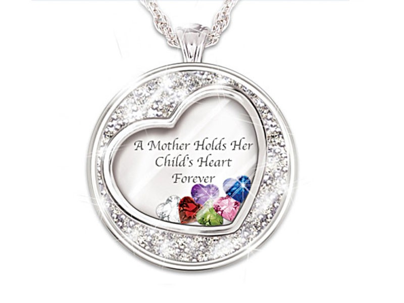 Mother Holds Her Child's Heart Birthstone Pendant With Names